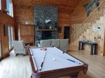 On a rainy day, enjoy the pool table or watch a movie by the fireplace